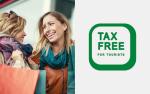dwie uśmiechnięte kobiety z zakupami i napis tax free for tourists
