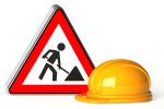 grafika ze znakiem drogowym informującym o robotach drogowych i żółty kask